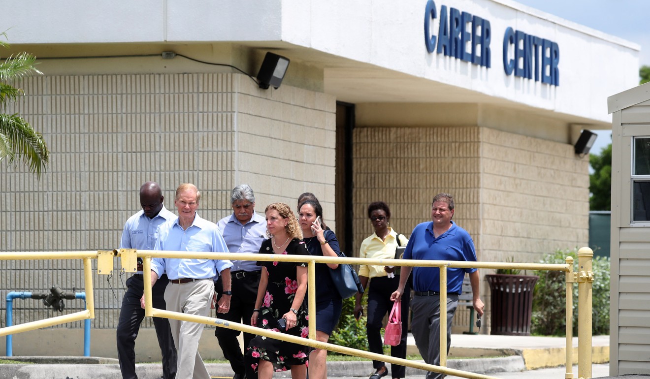 A delegation of Florida politicians including US Senator Bill Nelson (second from left) and US Representative Debbie Wasserman Schultz (fourth from left) are denied entry to a temporary shelter for migrant children in Homestead, Florida, on Tuesday. Photo: Sun Sentinel via TNS