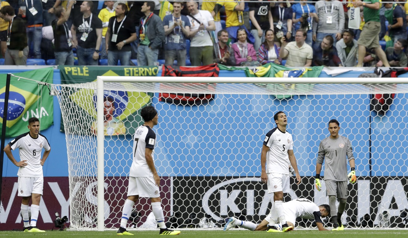 Costa Rica players react after the opening goal. Photo: AP
