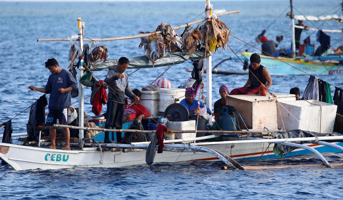 Philippine fishermen at the disputed Scarborough Shoal. Photo: Reuters