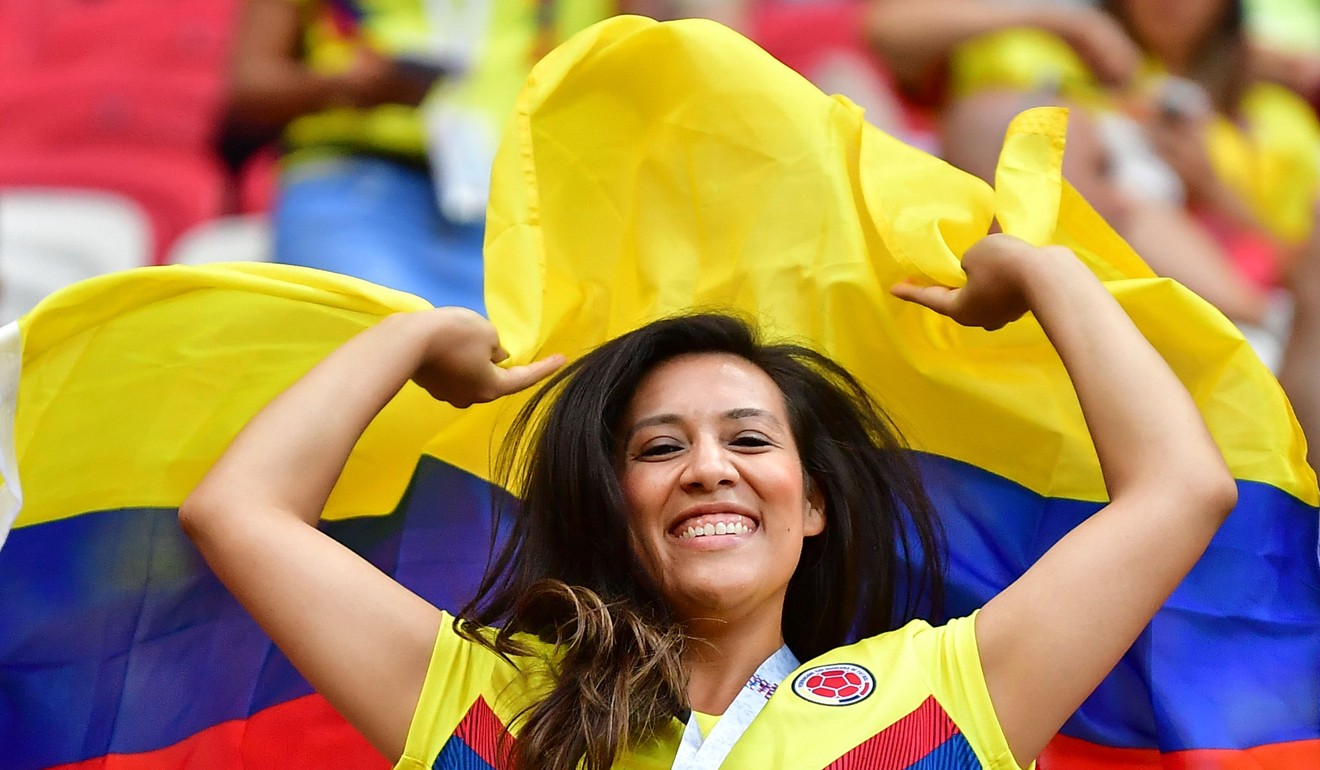 A Colombia fan waves a flag in the crowd before kick-off of the Russia 2018 World Cup group H football match between Poland and Colombia at the Kazan Arena. Photo: AFP