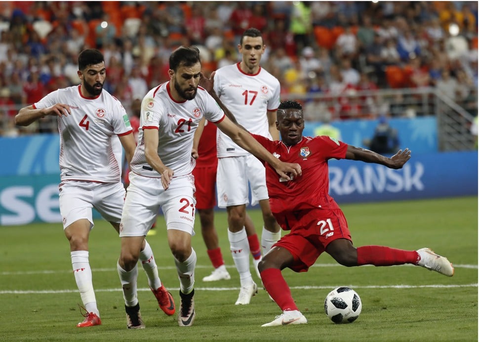 Panama’s Jose Luis Rodriguez is challenged by Tunisia’s Hamdi Naguez. Panama finished their World Cup campaign without a point. Photo: AP
