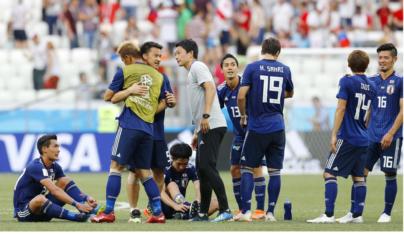 Japan’s manager told his players to adopt a more cautious approach for the last 10 minutes of their defeat against Poland, despite boos from their own fans. Photo: Kyodo