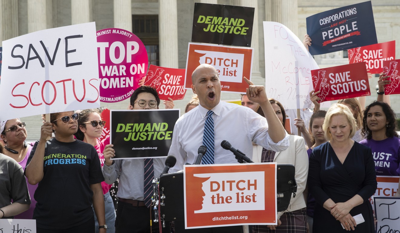 Senator Cory Booker, a New Jersey Democrat, speaks as he and activists demonstrate at the Supreme Court on Thursday. Photo: AP