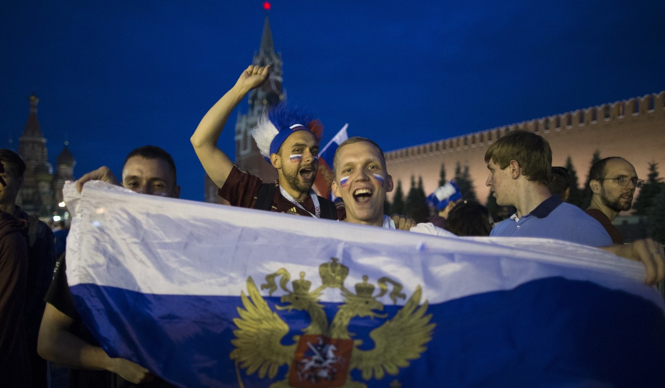Russia soccer fans celebrate their team victory against Spain in Red Square. Photo: AP