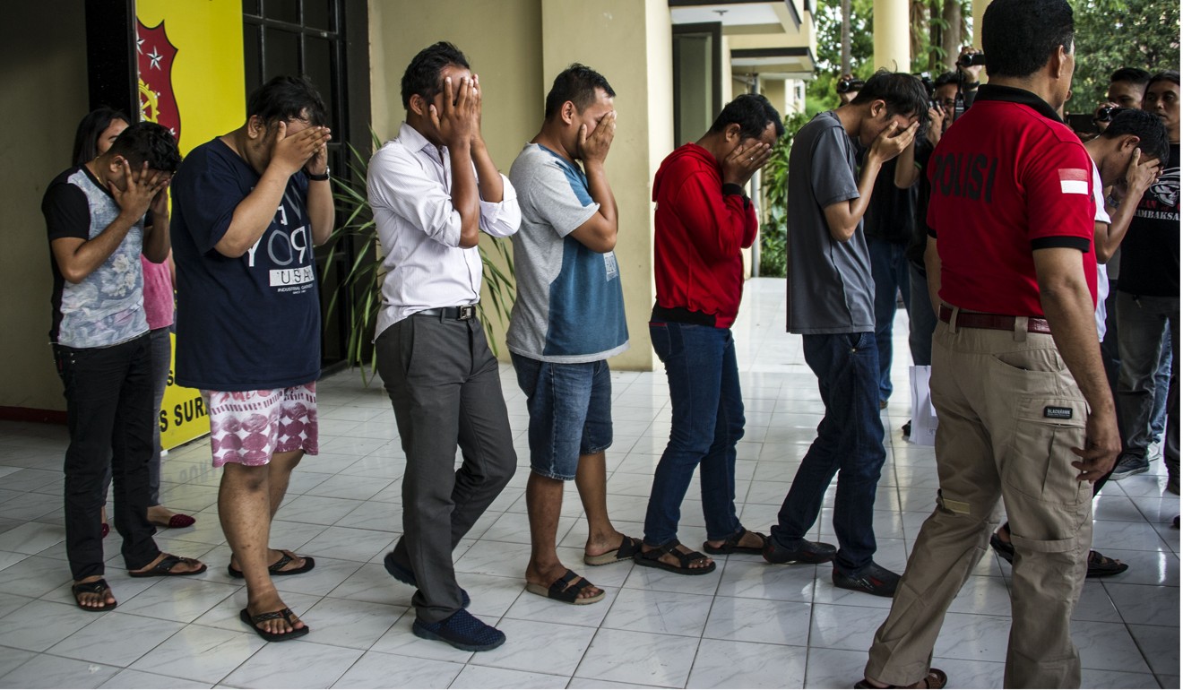 Indonesian police parading a group of men arrested for allegedly having a ‘gay party’ in Surabaya. Photo: AFP
