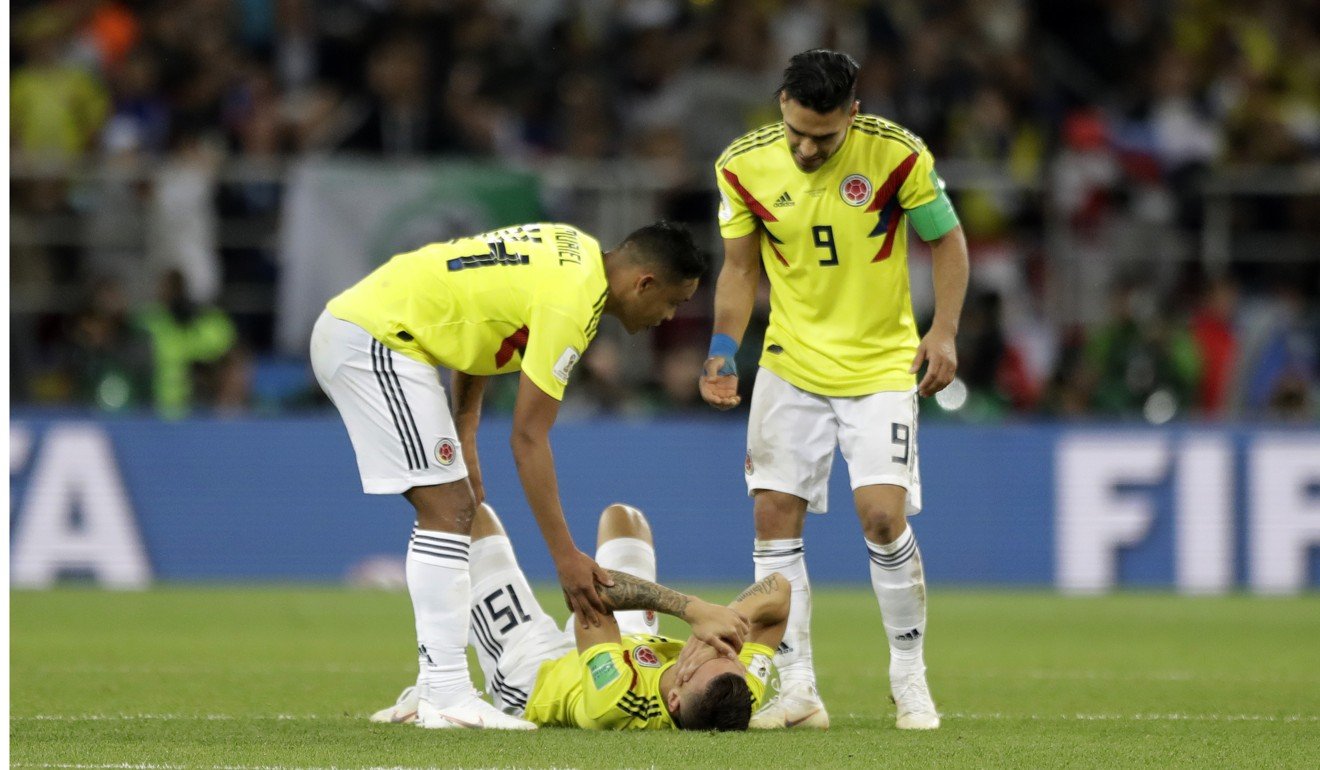 Colombia's Mateus Uribe, bottom, reacts after he failed to score a penalty. Photo: AP