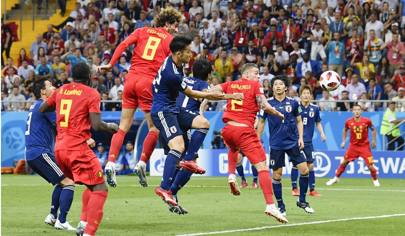 Marouane Fellaini heads Belgium level against Japan. Photo: Kyodo