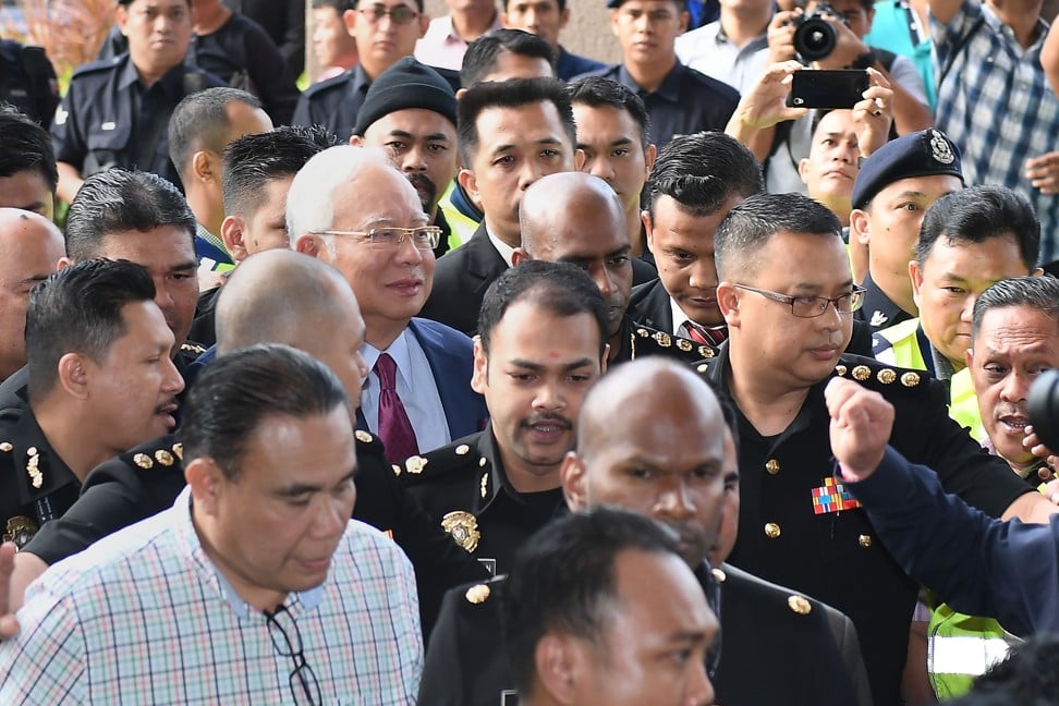 Former Malaysian prime minister Najib Razak, centre left, on Wednesday. Photo: AFP