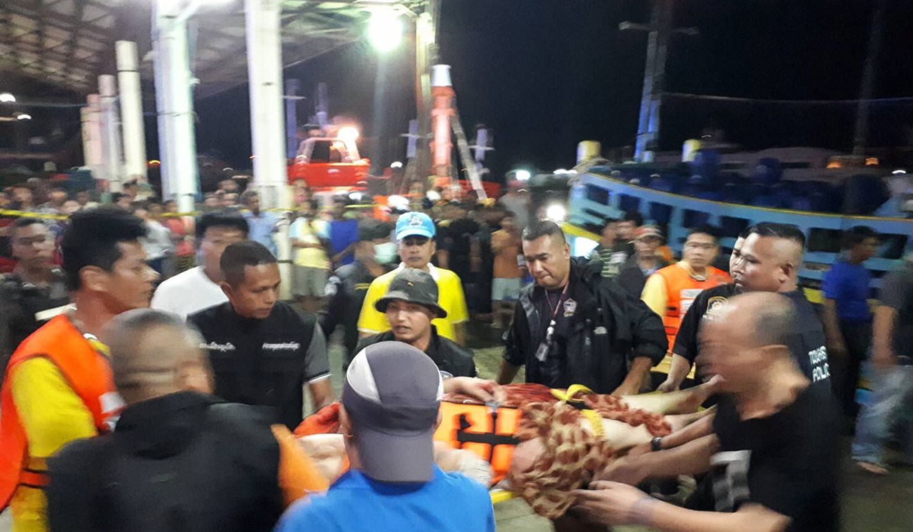 Thai rescue and paramedic personnel attend to rescued passengers of capsized tourist boat at Phuket on Thursday. Photo: Agence France-Presse