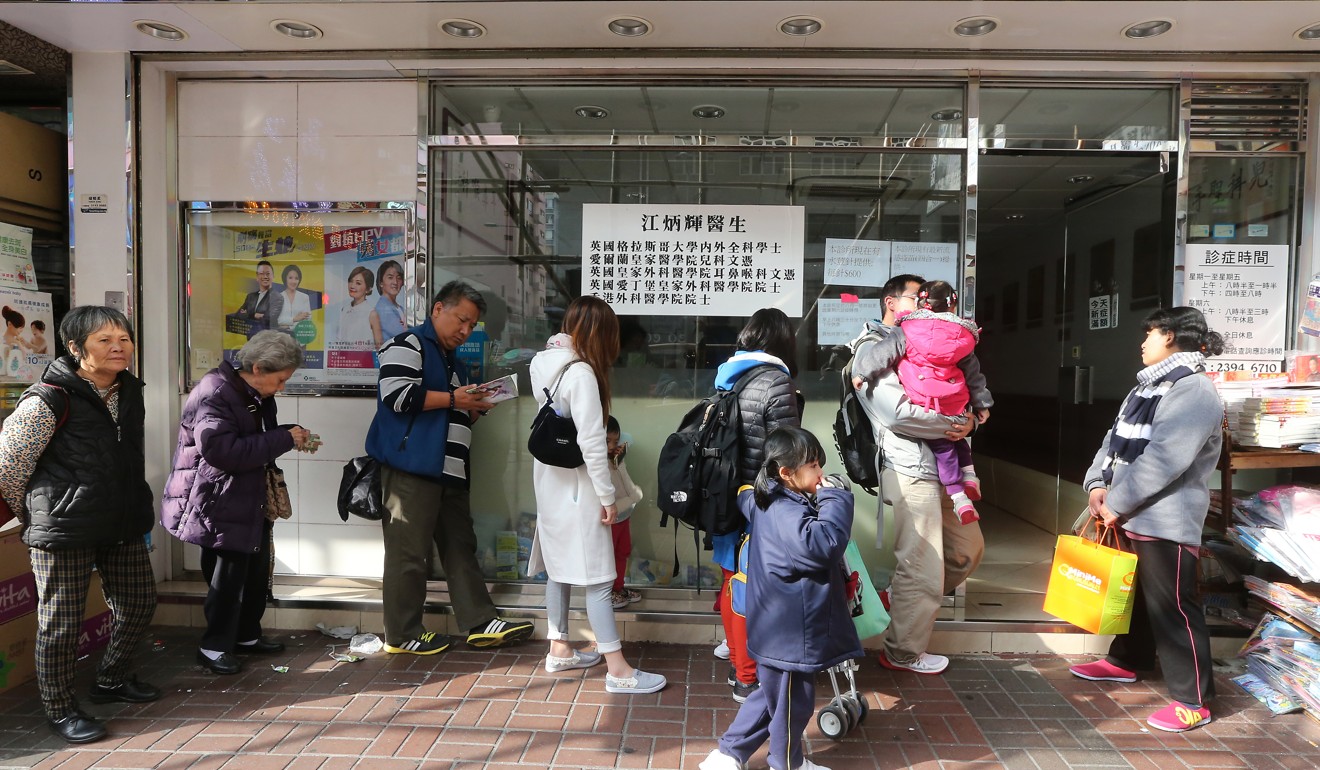 Patients wait outside a clinic in Mong Kok. Photo: Handout