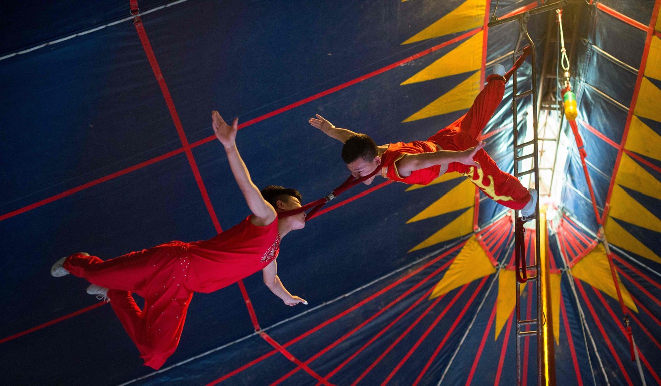 Acrobats perform during a Chinese Prosperous Nation Circus Troupe show in Dongguan. Photo: AFP