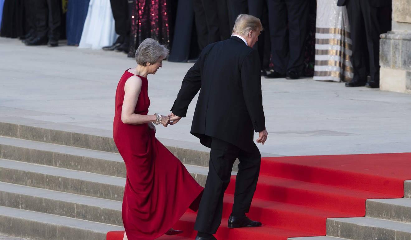 US President Donald Trump and British Prime Minister Theresa May arrive at Blenheim Palace on Thursday. Photo: EPA