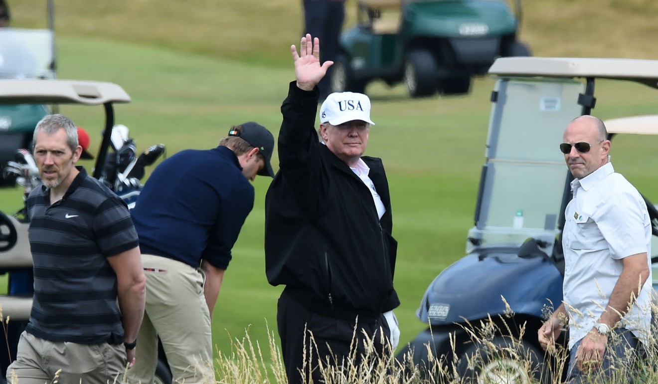 US President Donald Trump gestures as he walks during a round of golf at his Trump Turnberry in Scotland. Photo: AFP