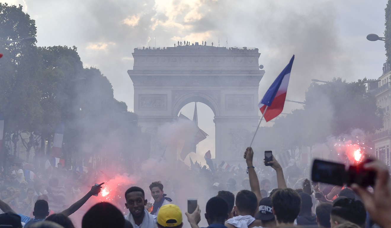 French fans celebrate on the Champs-Elysees in Paris. Photo: Xinhua