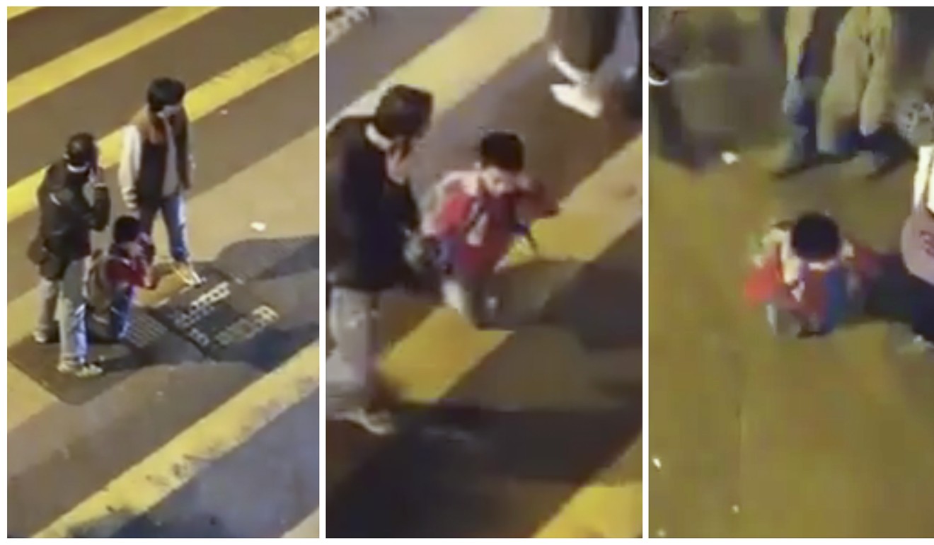 A Hong Kong construction worker punished his eight-year-old son for doing badly in school by making him cross a busy road on his knees. Photo: Facebook