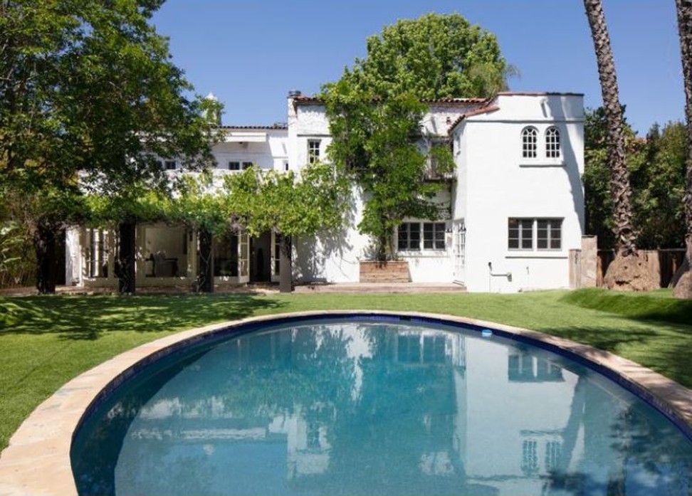 The two-storey home, built in 1919, sits on a third of an acre and has an oval swimming pool. Photo: Lee Manning