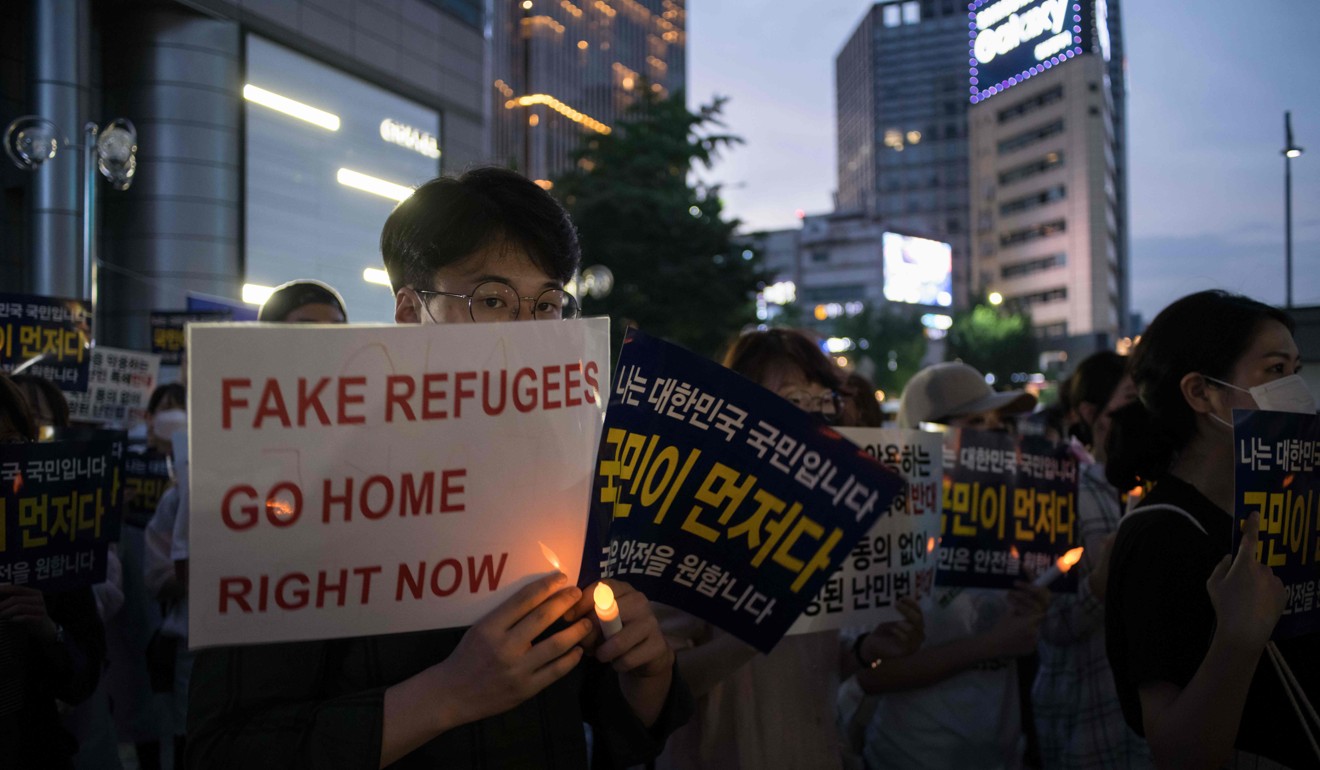 Anti-immigration activists in Seoul, South Korea, attend a protest against a group of asylum seekers from Yemen, on June 30. Hundreds of asylum seekers fleeing war-ravaged Yemen have landed on the southern island of Jeju, sparking calls for their expulsion. Photo: AFP