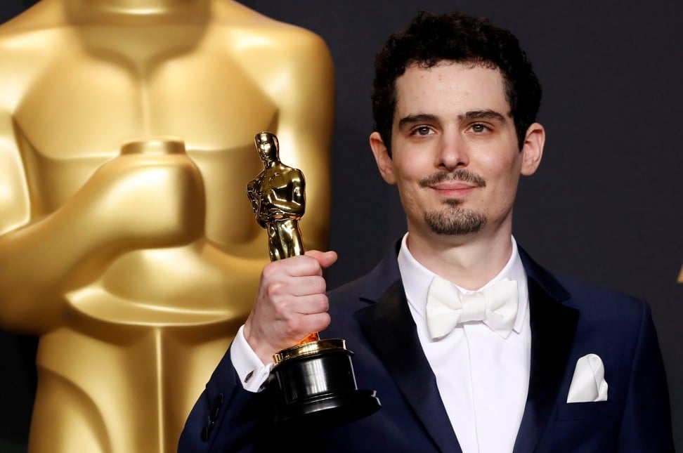 Damien Chazelle poses with his Oscar for Best Director for the film ‘La La Land’ in February, 2017. Photo: Reuters