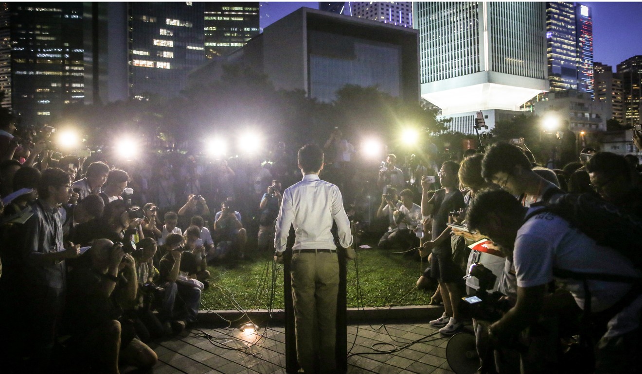 Andy Chan Ho-tin, convenor of Hong Kong National Party, makes an announcement regarding Legislative Council election candidacy at Tamar Park in Admiralty in August 2016. Photo: Sam Tsang