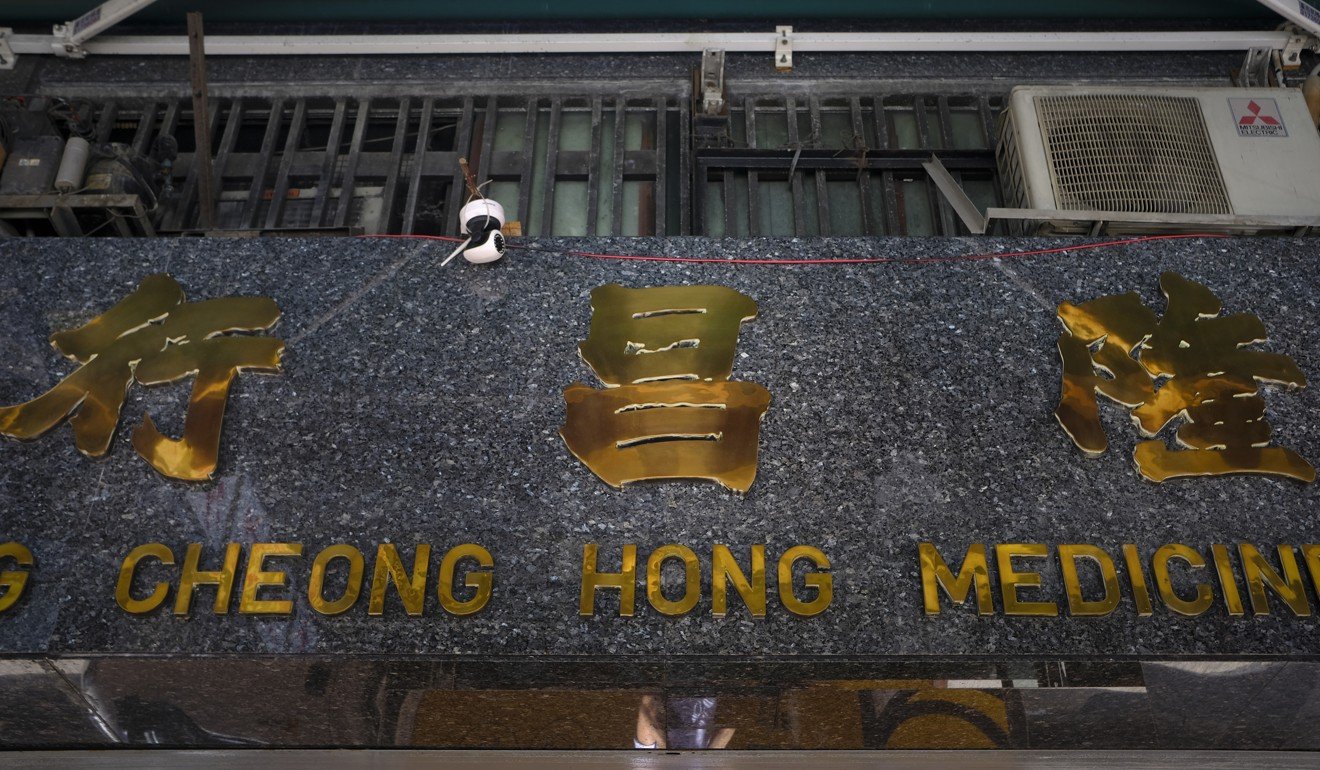 Areas with traditional businesses such as Sheung Wan, where this Chinese medicine store is, showcase Beiwei calligraphy. Photo: James Wendlinger