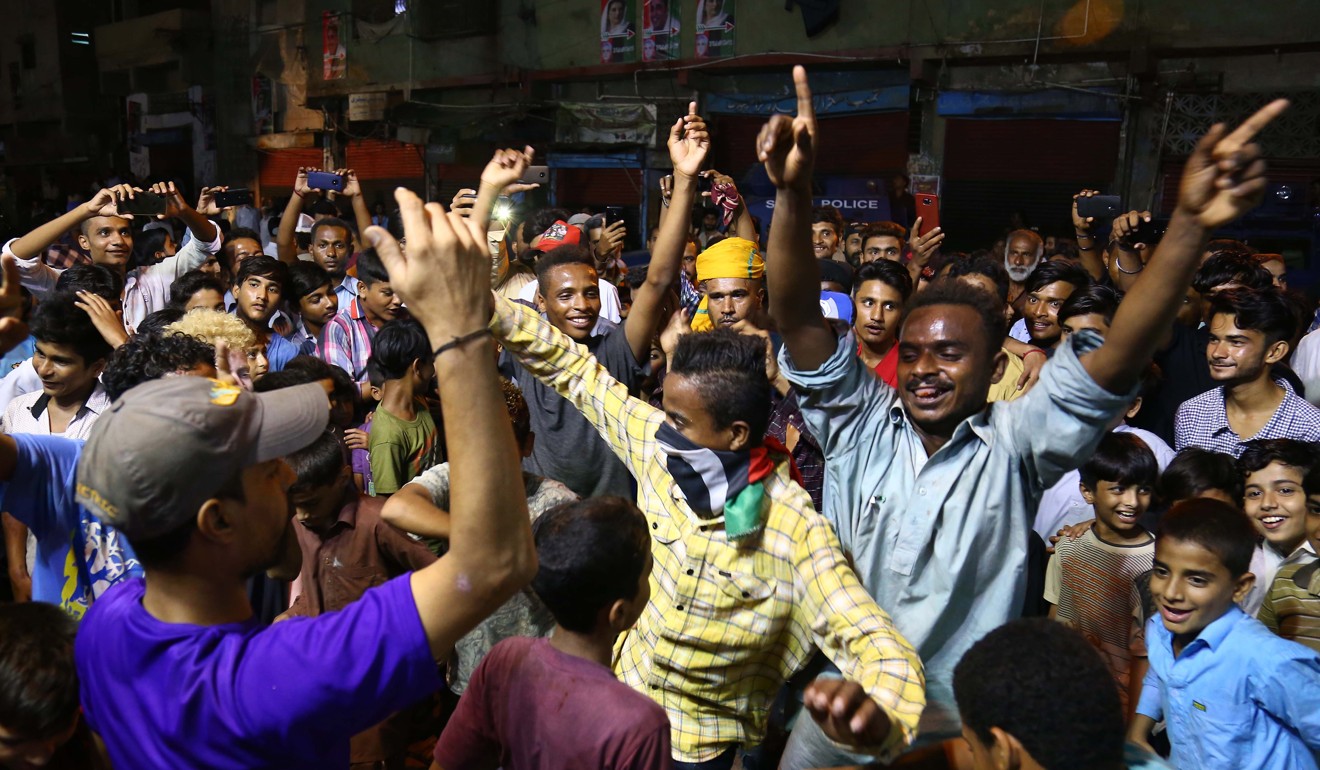 Young Pakistanis dancing at a political rally in Karachi. Photo: EPA