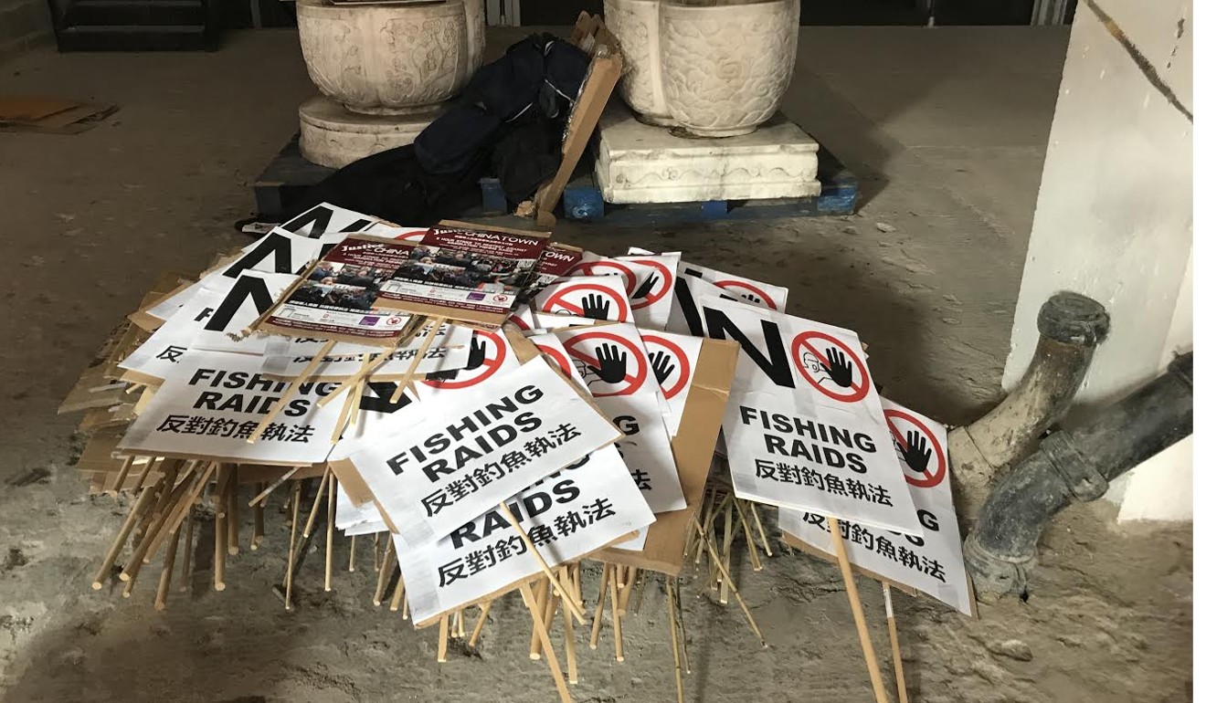 Signs saying “No Fishing Raids” await a protest march from Chinatown to the UK Home Office. Photo: Hilary Clarke