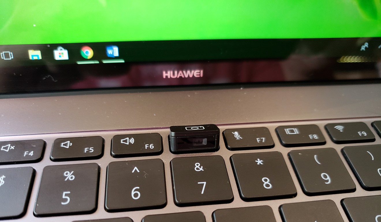 The camera on the Huawei MateBook X Pro is hidden underneath the keyboard, popping up only when the camera is being used. Photo: Ben Sin