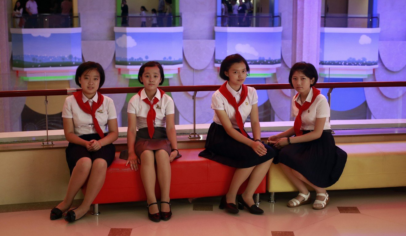 Schoolgirls sit on a couch at the Mangyongdae Children’s Palace in Pyongyang. Photo: AP