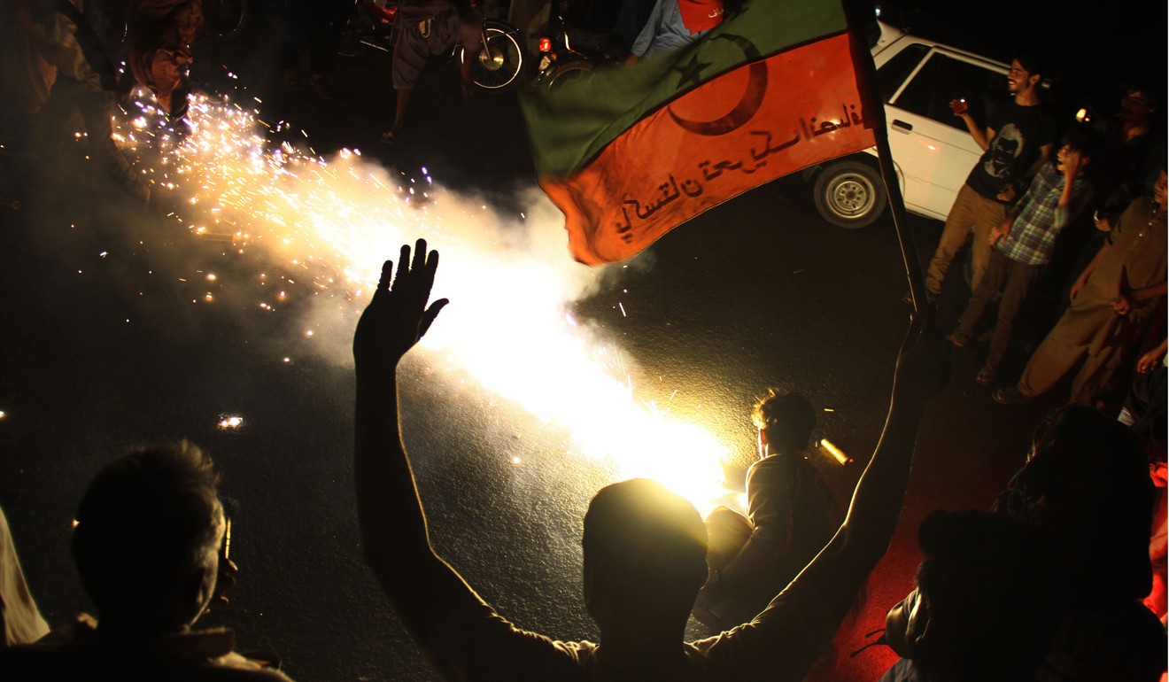 Supporters of Imran Khan, head of the PTI party celebrate in Hyderabad, Pakistan, on July 26. Photo: EPA-EFE
