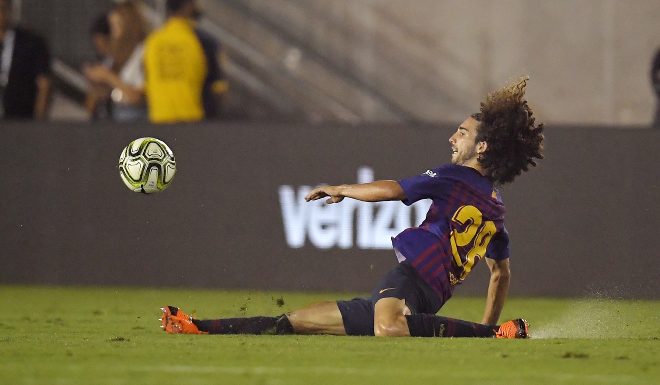 Barcelona’s Marc Cucurella slides as he lunges for the ball during the second half of the International Champions Cup match against Tottenham. Photo: AP