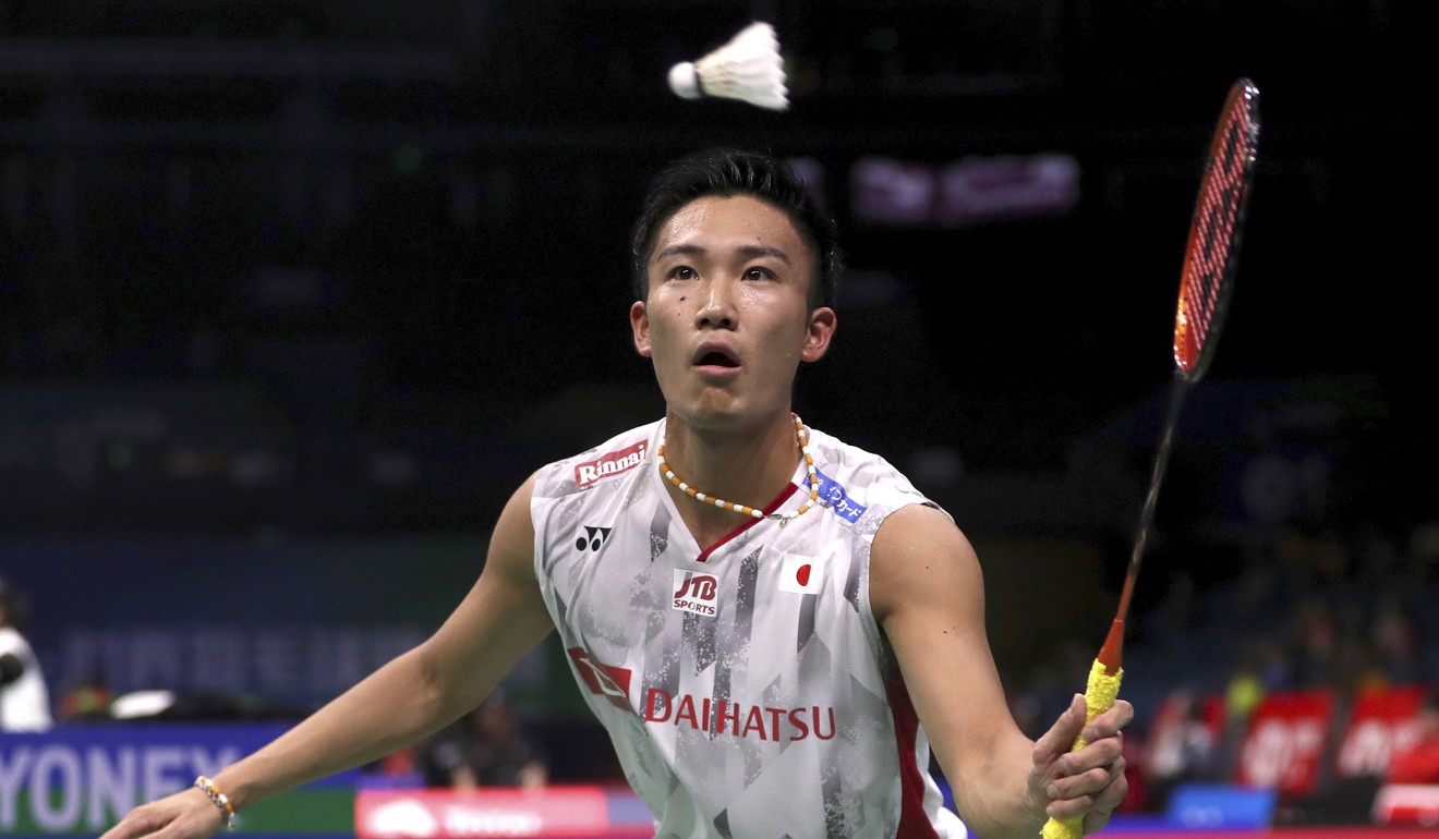 Tournament favourite Kento Momota, of Japan, plays a shot against Austria’s Luka Wraber. Photo: AP