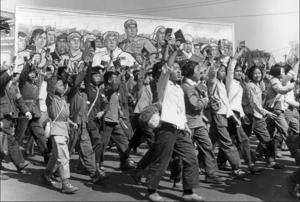 Red Guards – high school and university students – wave copies of Mao Zedong’s “little red book” as they parade in the streets of Beijing during the Cultural Revolution in 1966. Photo: AFP