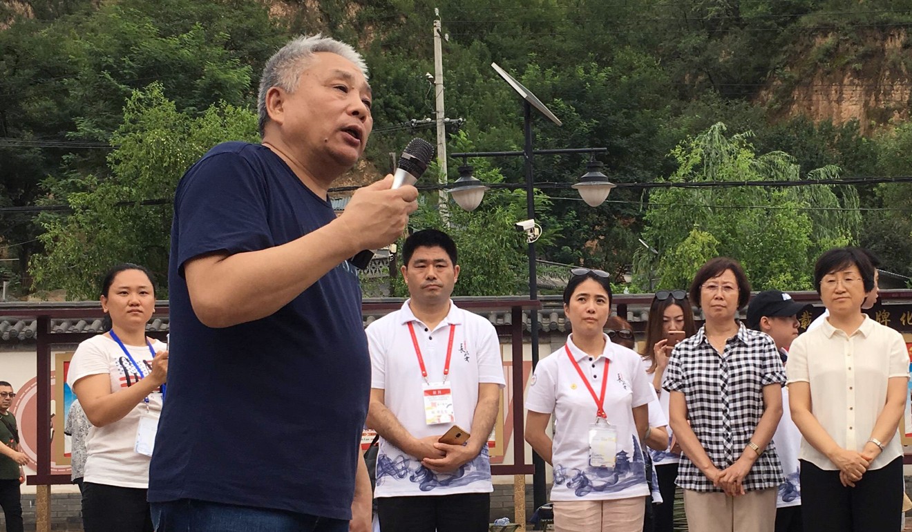 Lei Pingsheng, who shared cave dormitories with Xi Jinping, addresses visitors to the site on Tuesday. Photo: Phila Siu