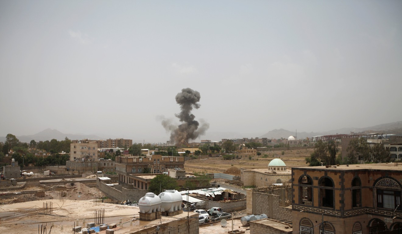 Smoke rises after an air strike in Sanaa. Photo: Reuters