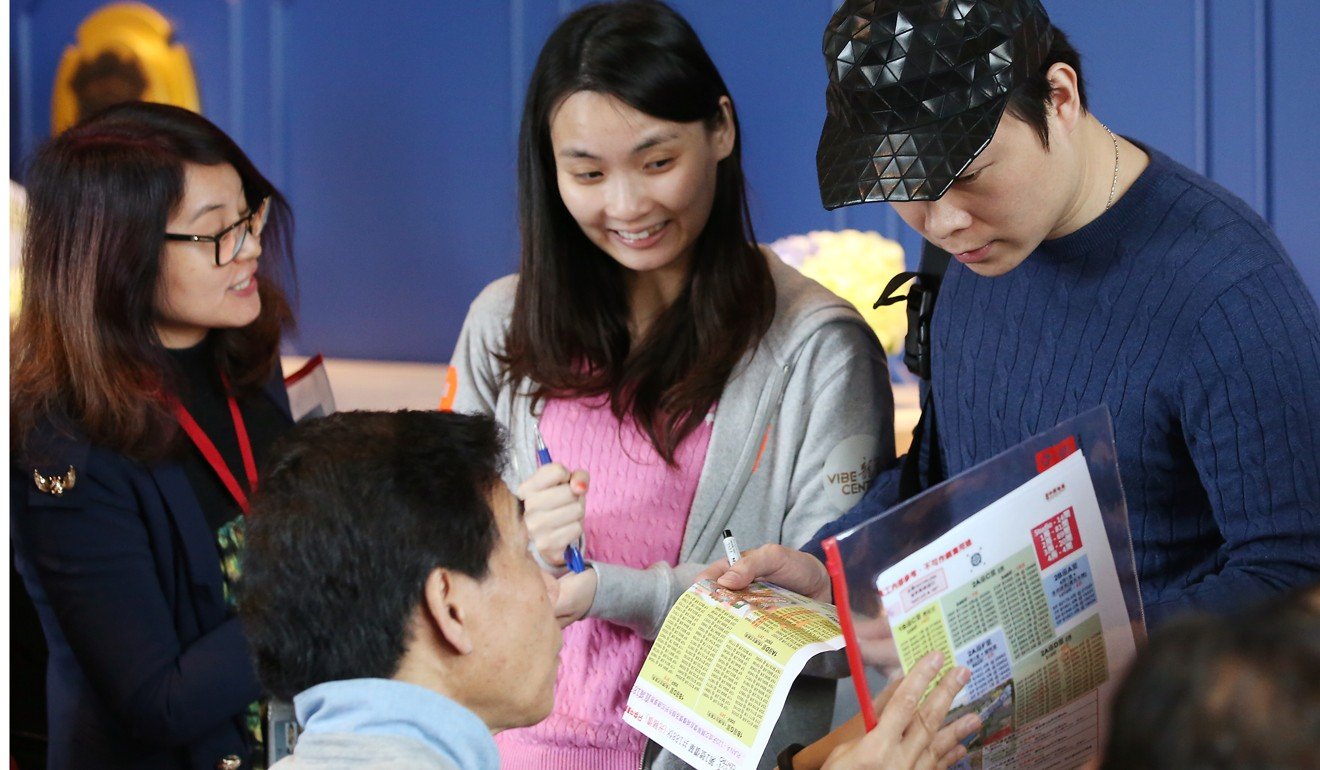 Potential buyers visit the sales office of Vibe Centro, a residential development by Poly Property Group in Hong Kong’s Kai Tak area, in March 2017. Photo: Edward Wong