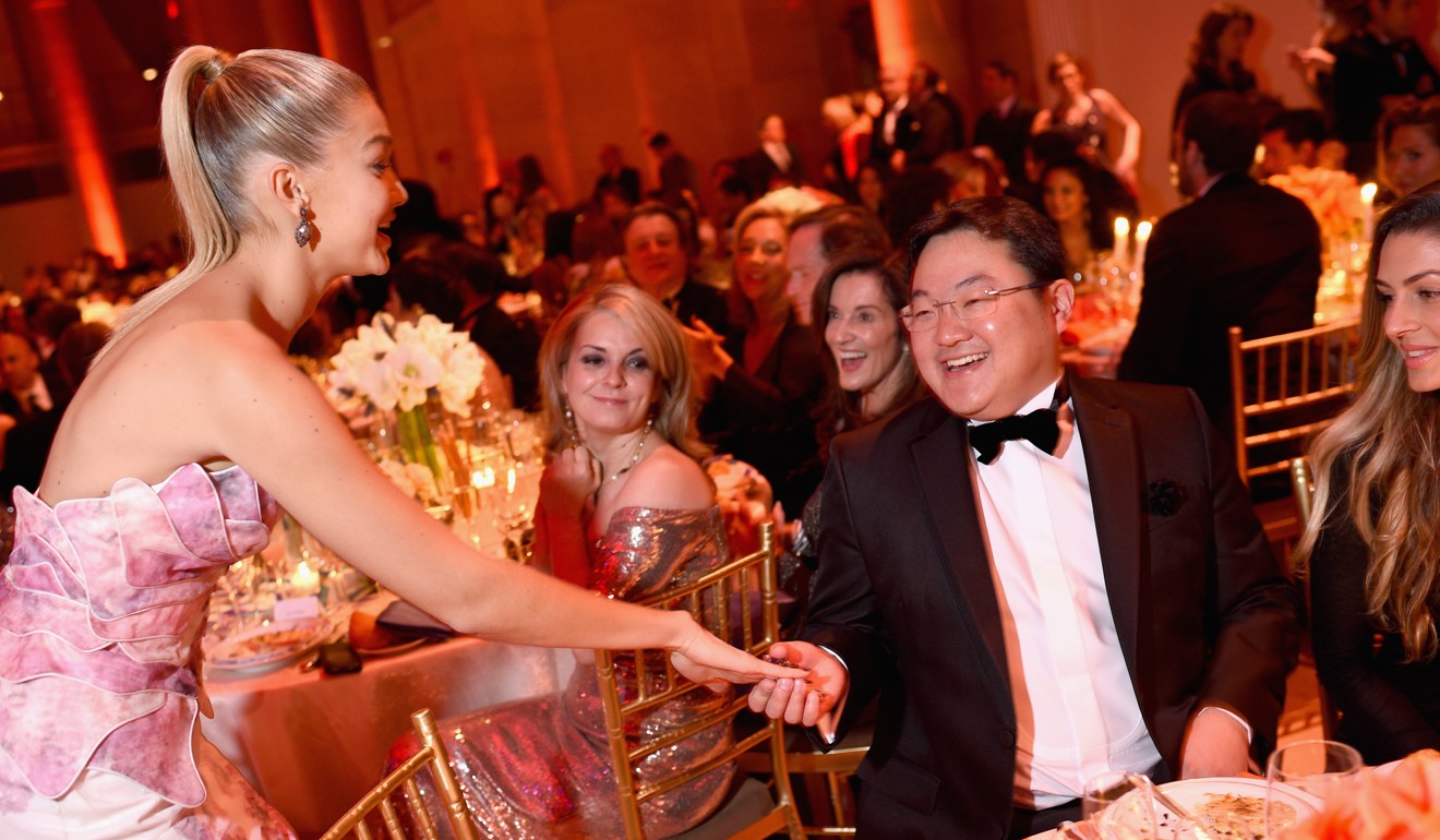 Jho Low at a ball in 2014 with US model Gigi Hadid. Photo: AFP
