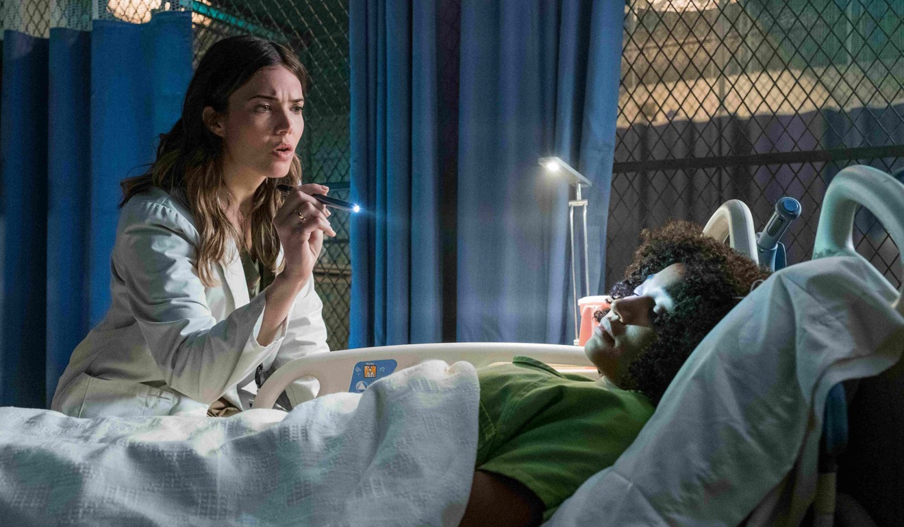 Mandy Moore (left) and Stenberg in a still from The Darkest Minds.