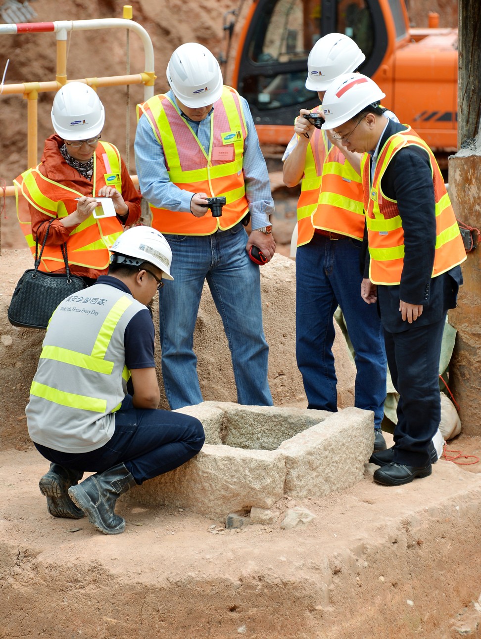 Members of Hong Kong’s Antiquities Advisory Board visit Song and Yuan dynasty monuments at the site of the Sha Tin to Central Link in Kai Tak.