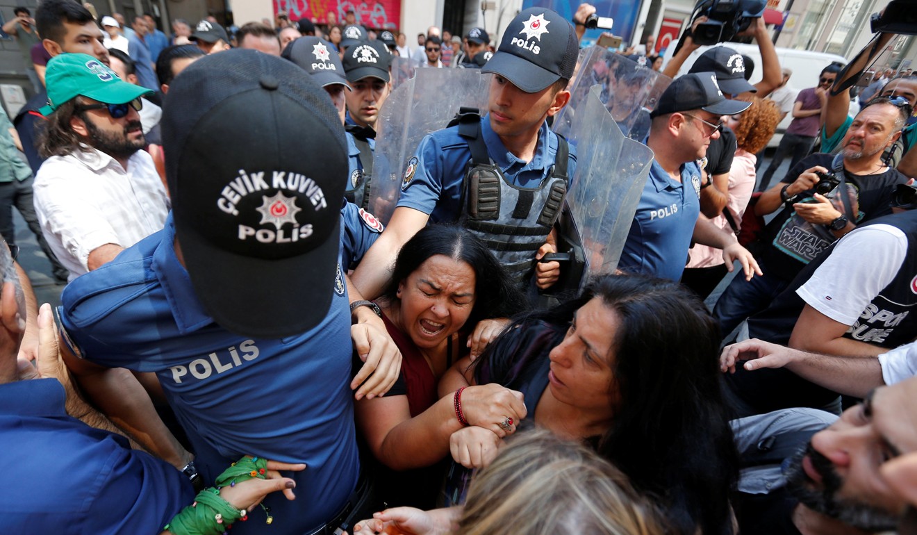 Demonstrators scuffling with the police in Istanbul on Saturday. Photo: Reuters