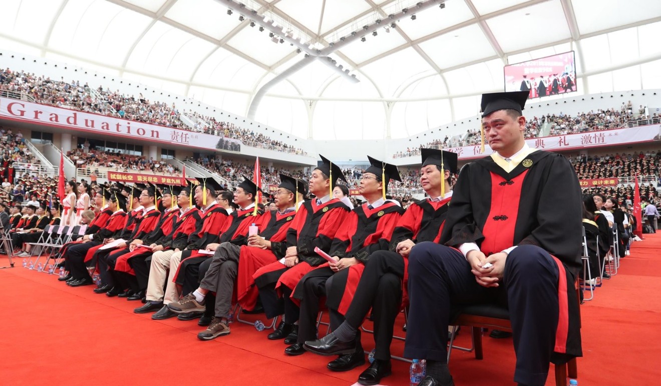 Yao Ming sits with students at the graduation ceremony of Shanghai Jiao Tong University. Photo: Twitter