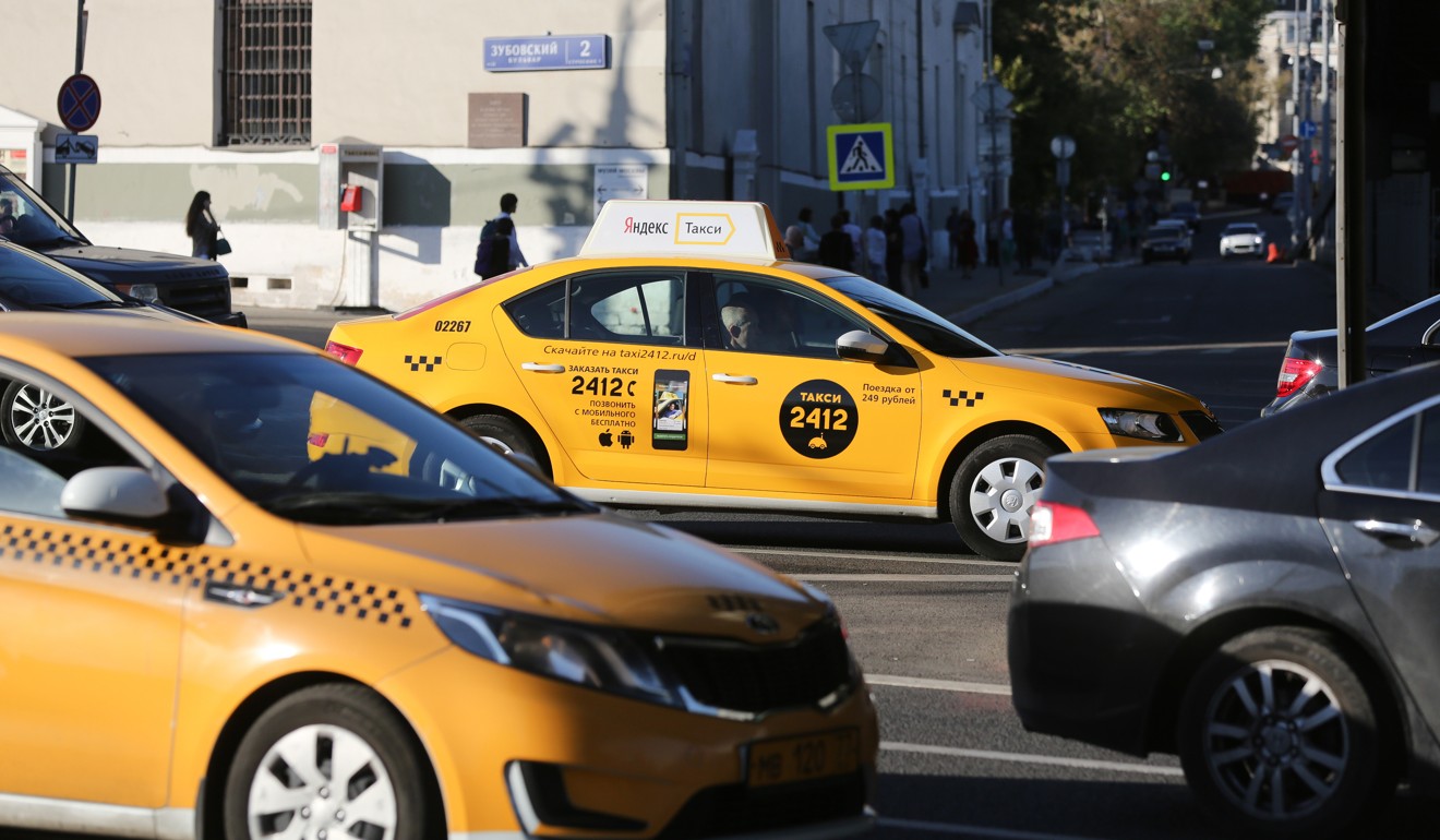 Russian taxi cabs seen on a street in Moscow, Russia. Photo: Bloomberg
