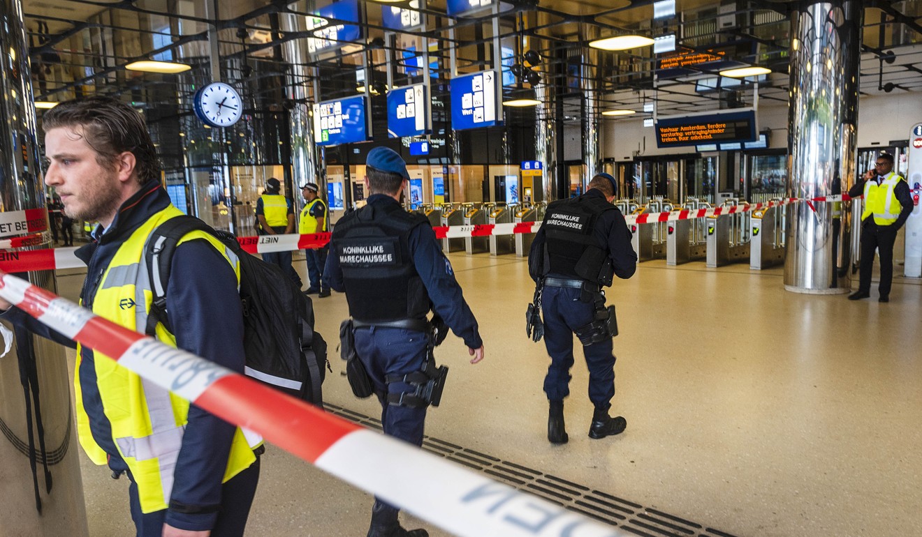 The police inside Amsterdam’s Central Station where the stabbing took place. The suspect is a 19-year-old Afghan with a German residency permit. Photo: Xinhua