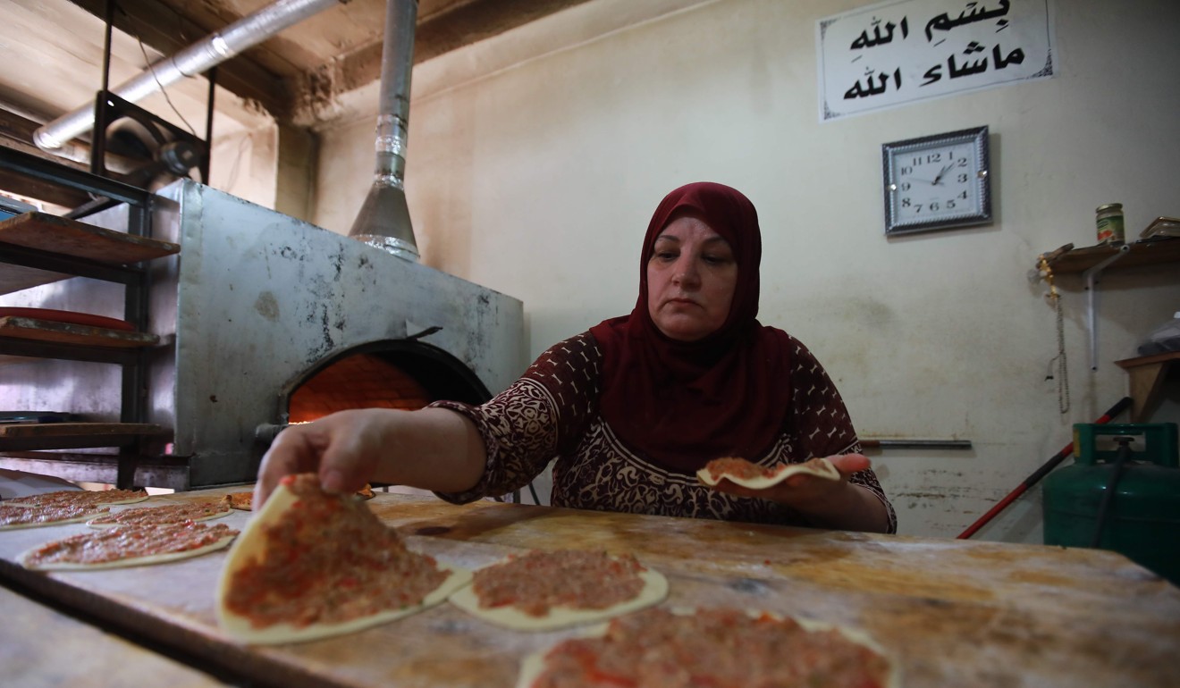 A woman working at a bakery in the Palestinian refugee camp Burj al-Barajneh, south of the capital Beirut, on Saturday. A UNRWA spokesman said the agency was “a force for regional stability”.