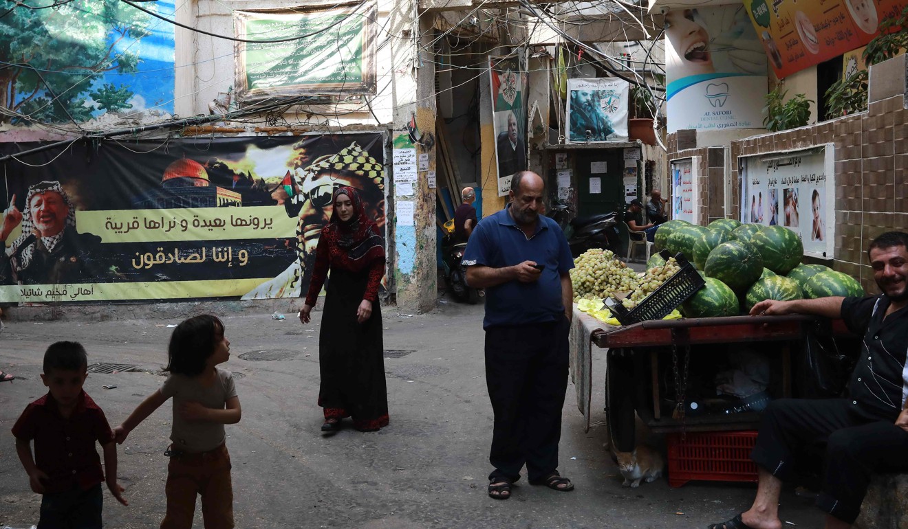 A street vendor selling fruits in the Shatila Palestinian refugee camp outside Beirut on Saturday. Photo: AFP