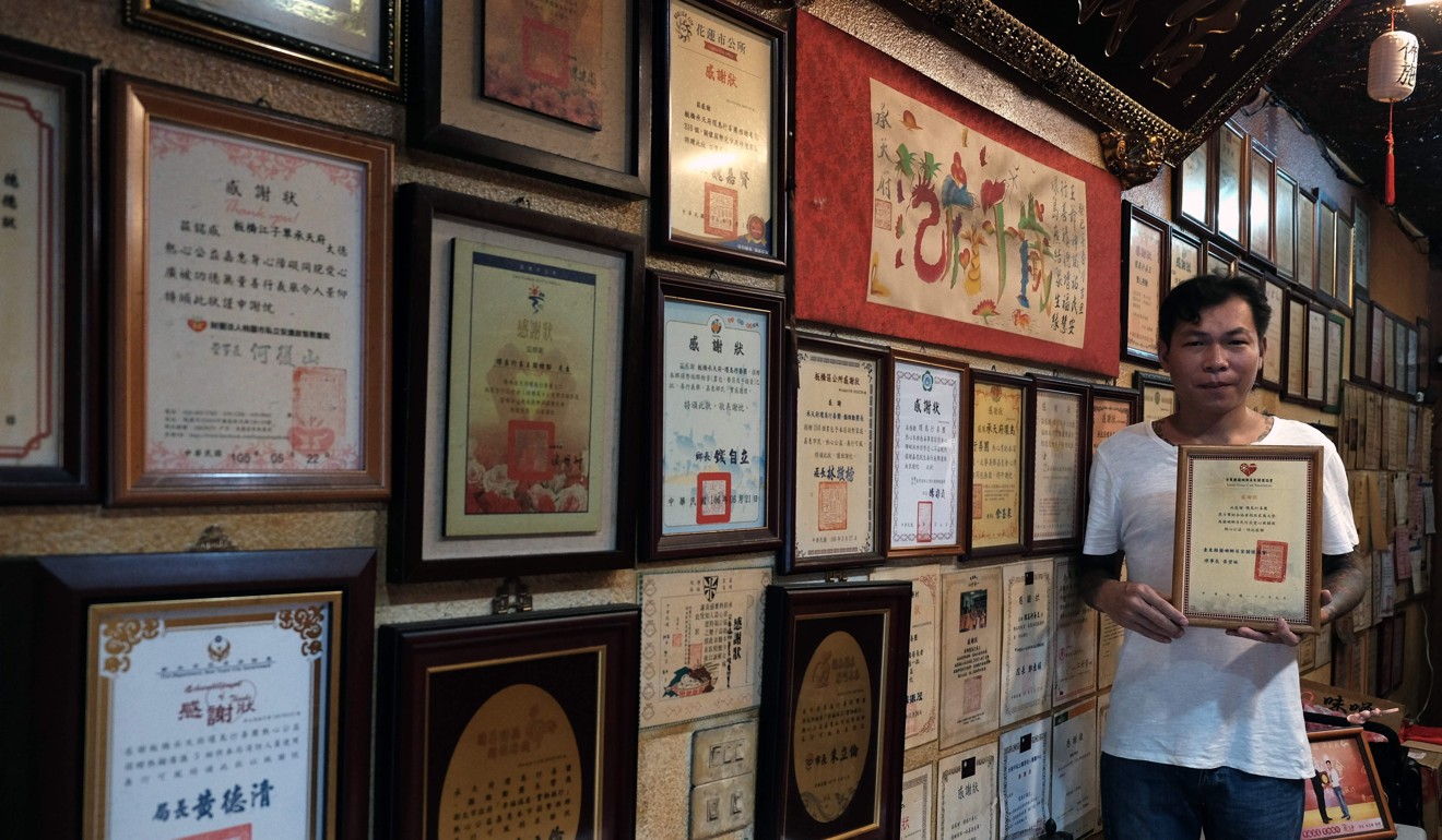 A wall of thank-you letters shows how far Yen Wei-shun has come since leaving the gangster life behind. Photo: AFP