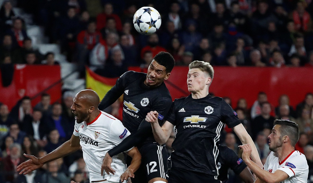 Manchester United’s Chris Smalling and Scott McTominay in action with Sevilla’s Steven N'Zonzi. Photo: Reuters
