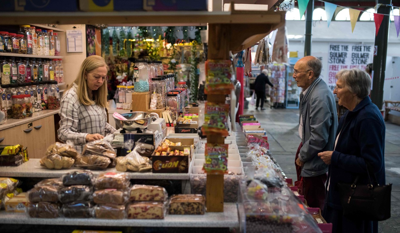 Specialist stalls and shops, such as this one selling confectionery, are starting to bring new life back to the centres of some English towns. Photo: AFP