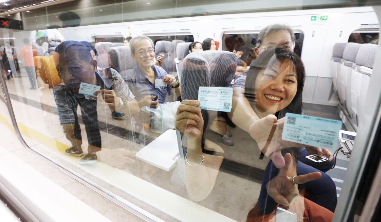 Passengers set off on the first train from West Kowloon station to Shenzhen North. Photo: Dickson Lee