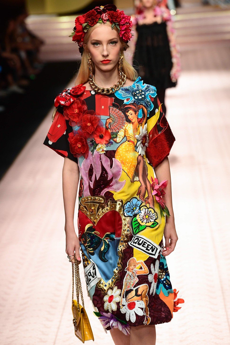 The show incorporated elements seen in previous collections, with tassels, embroidery, lace, flowers, Sicilian prints, religious iconography, roses, cartoons and more in a blaze of colour and creativity. Photo: AFP