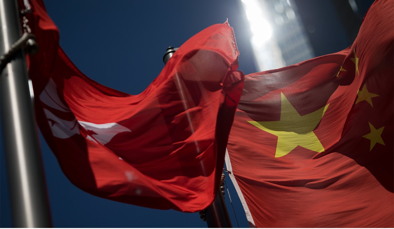 The Chinese and Hong Kong flags. Photo: EPA